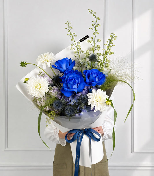 Royal blue roses, hydrangea and white dahlia bouquet with delphiniums