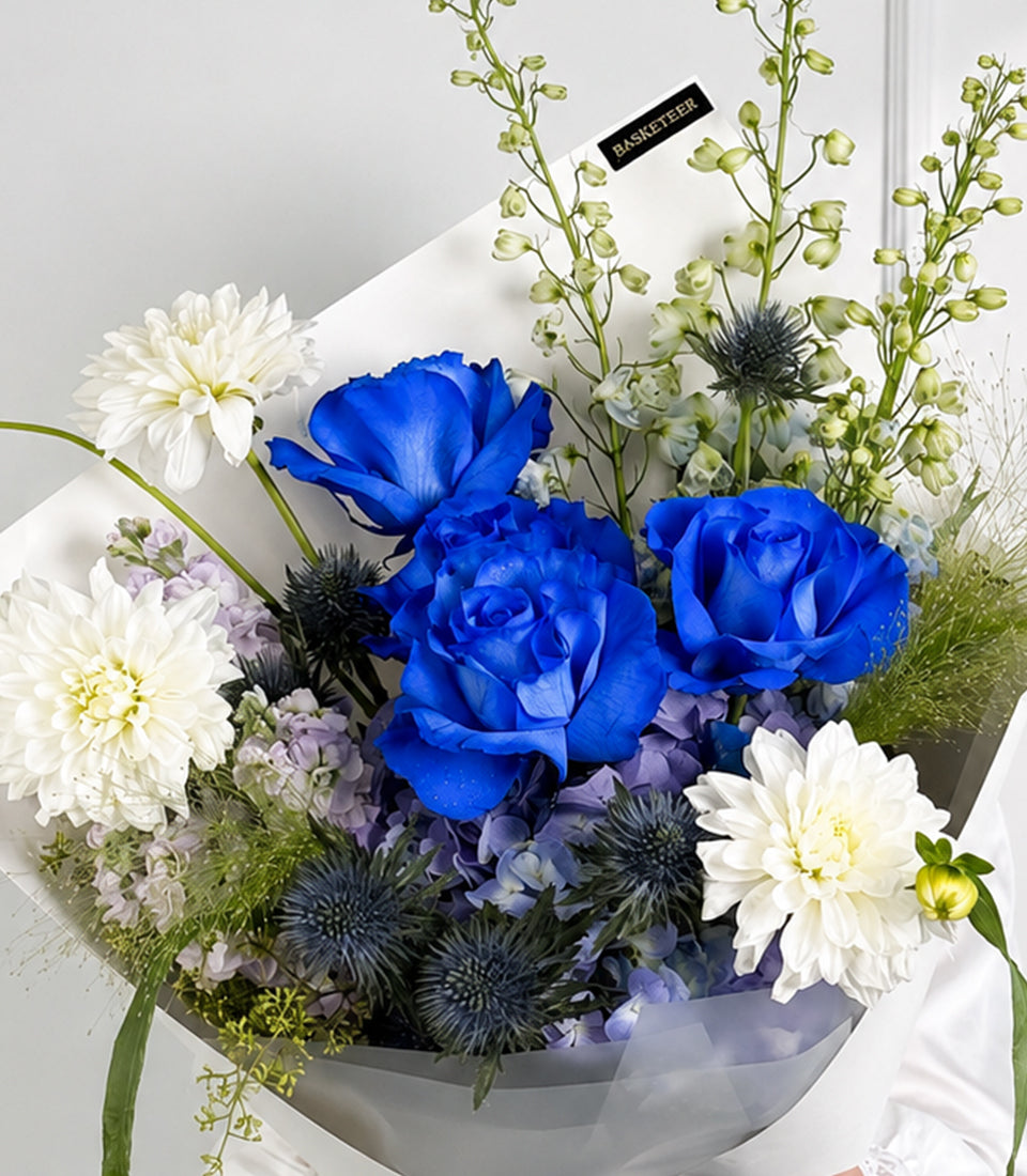 Royal blue roses, hydrangea and white dahlia bouquet with delphiniums