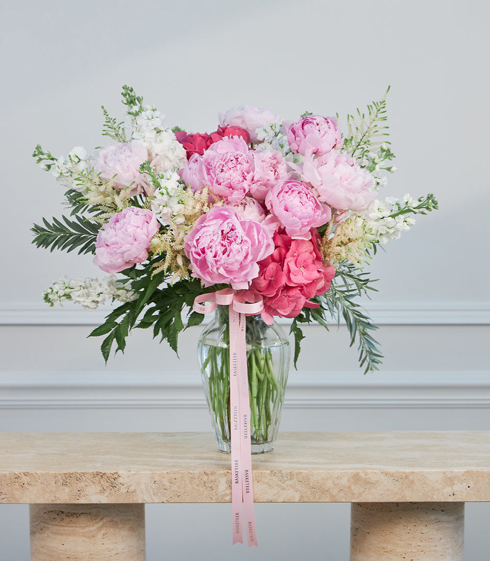 Premium pink peony and vibrant stock flower arrangement by Flowers by Basketeer,