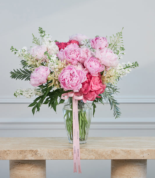Premium pink peony and vibrant stock flower arrangement by Flowers by Basketeer,