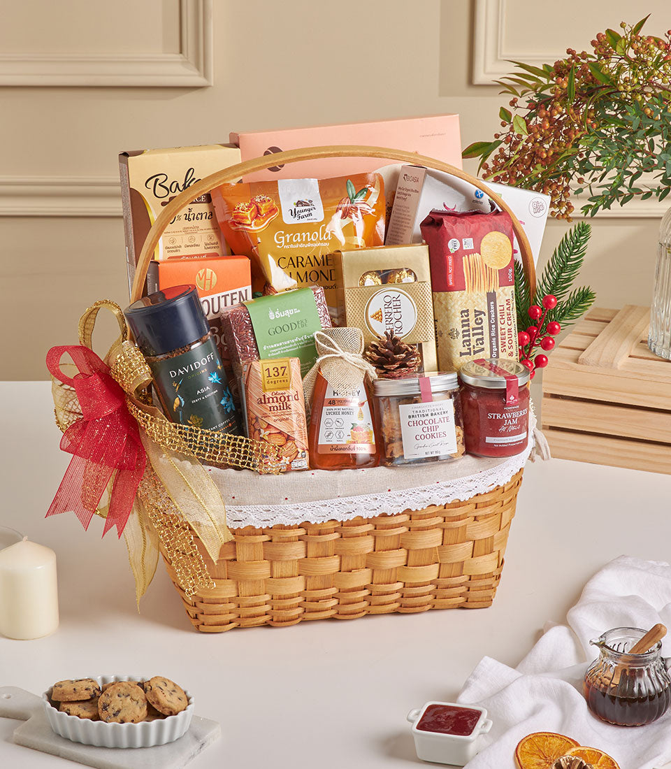 Luxury wicker gift basket with almond crackers, chocolate treats, lychee honey and gourmet goods, red and gold ribbon, New