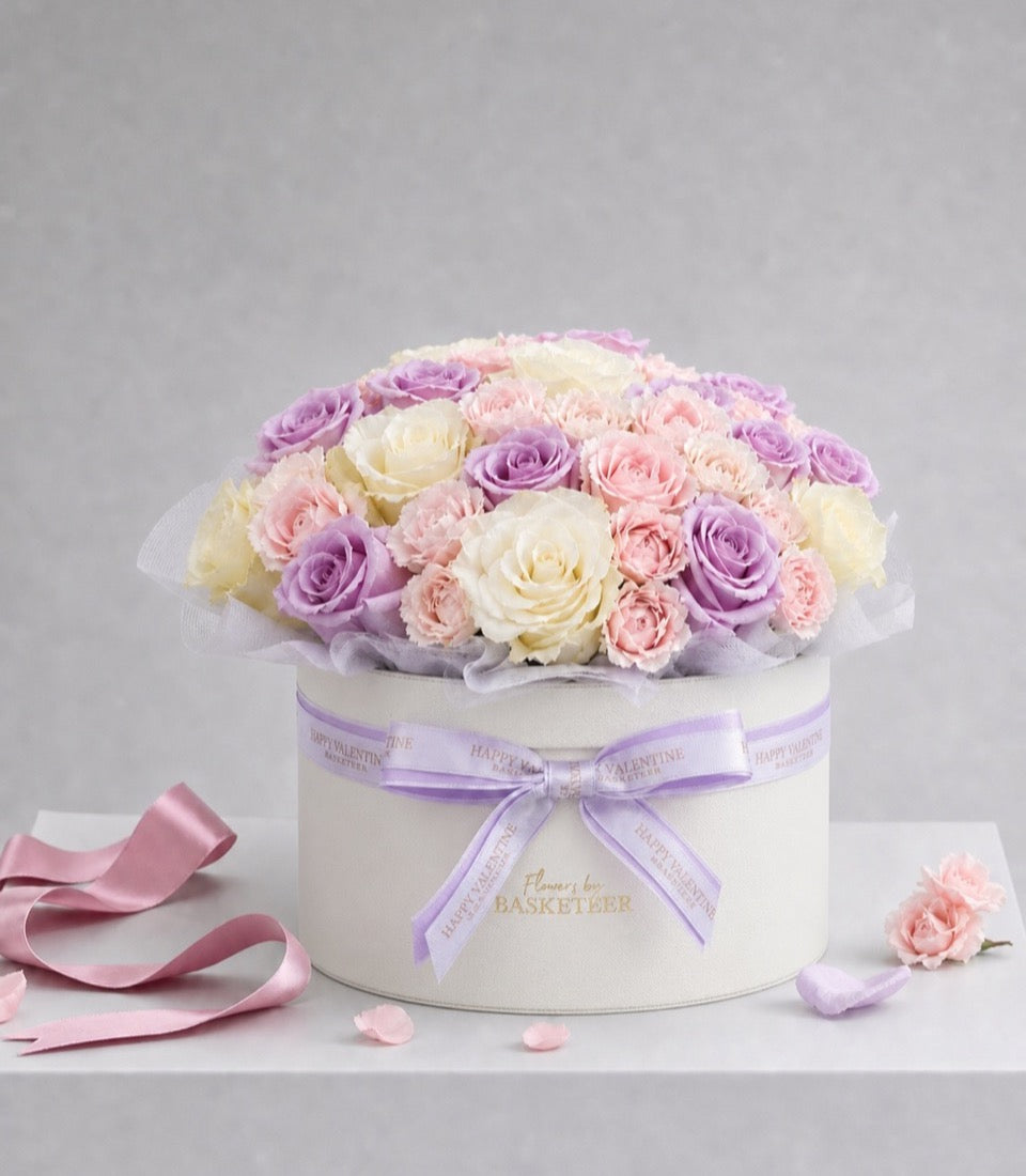 An elegant flower box arrangement from Flowers by Basketeer, featuring premium pastel lavender