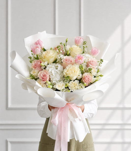 Luxurious Basketeer floral gift bouquet featuring soft pink and cream Mondial roses,