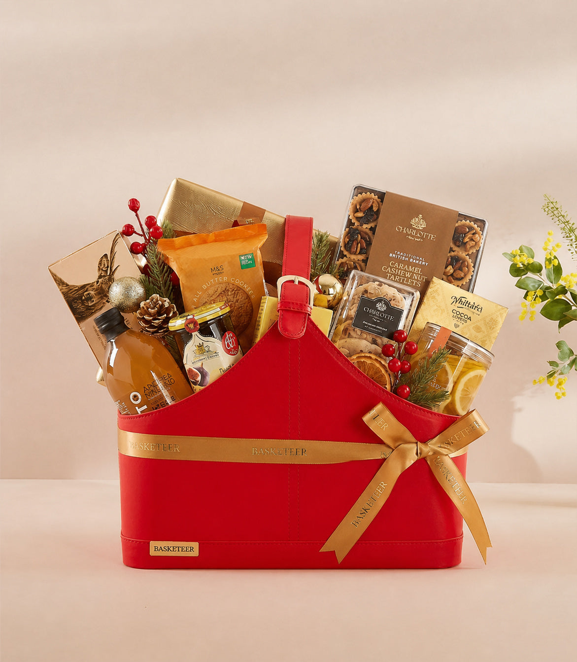 Basketeer luxury red gift basket with gold ribbon, filled with premium