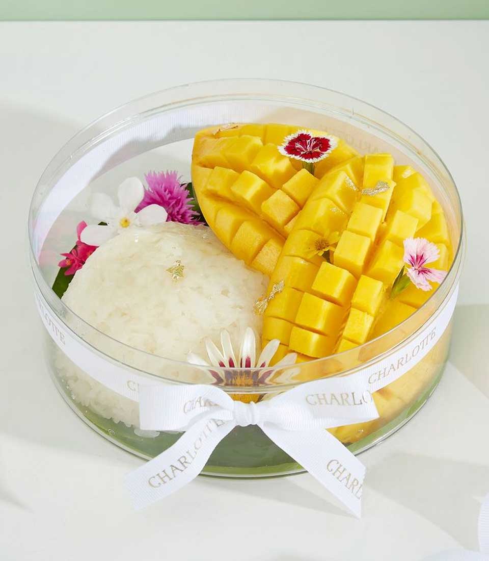 Luxury Thai mango sticky rice with gold leaf and fresh flowers in Charlotte Bakery gift box