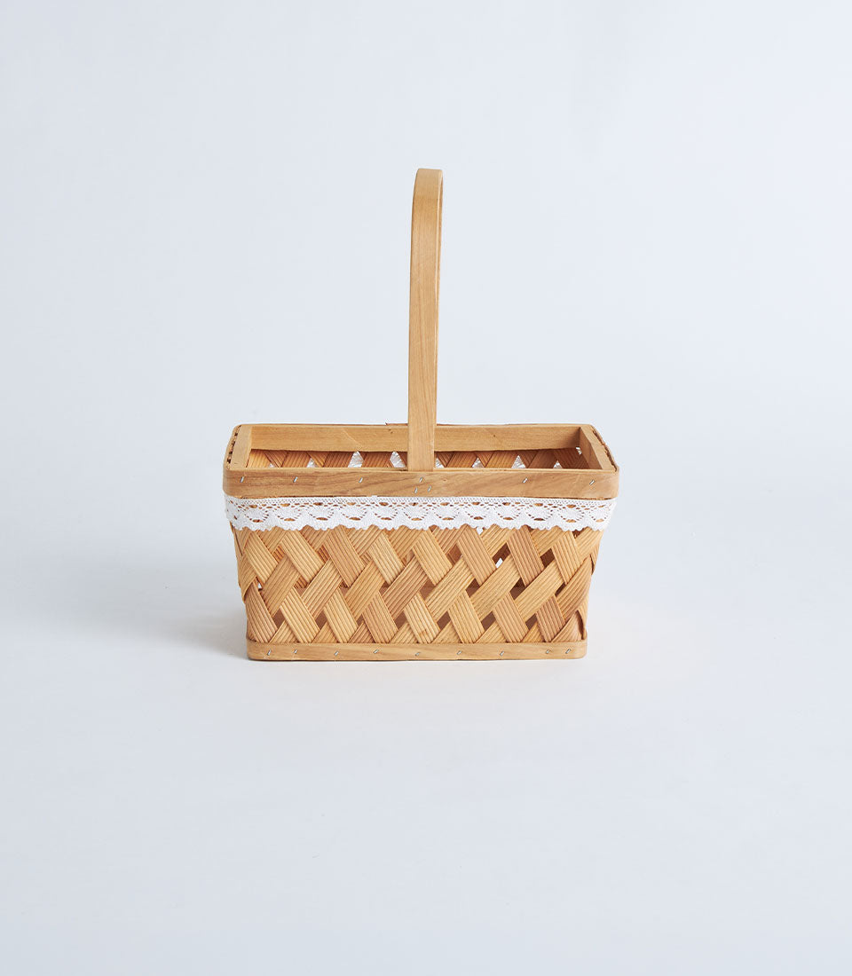 Woven bamboo rectangular basket with white scalloped lace trim and handle, perfect for luxury gift presentation