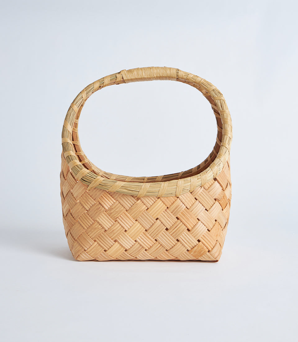 Handcrafted natural bamboo oval basket with woven wide handle