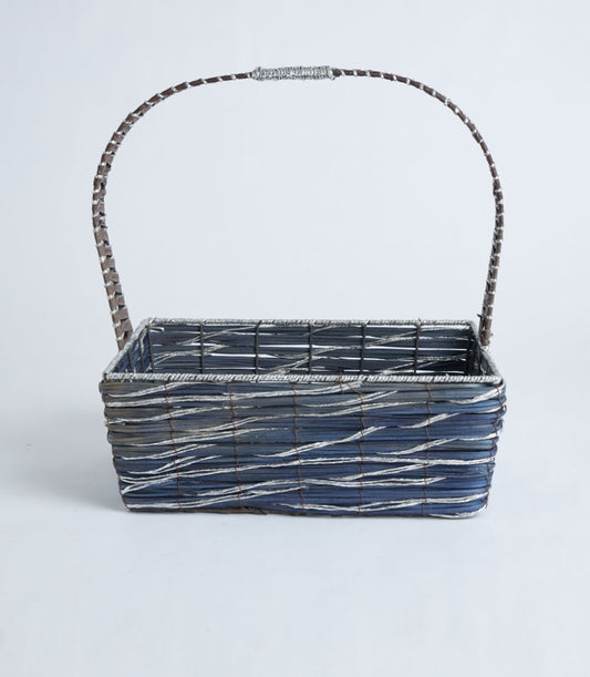 Slate blue woven gift basket with grey accents and arched handle