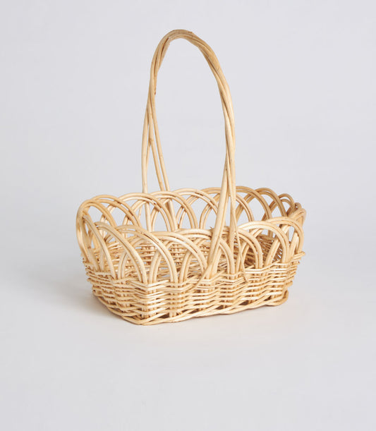 Natural wicker basket with arched handle and open-weave design, handwoven decorative oval gift basket