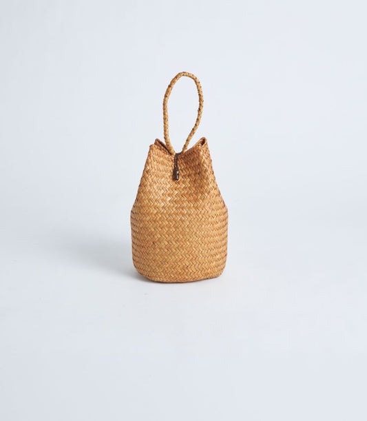 Light brown woven straw gift basket with rope handle and toggle closure