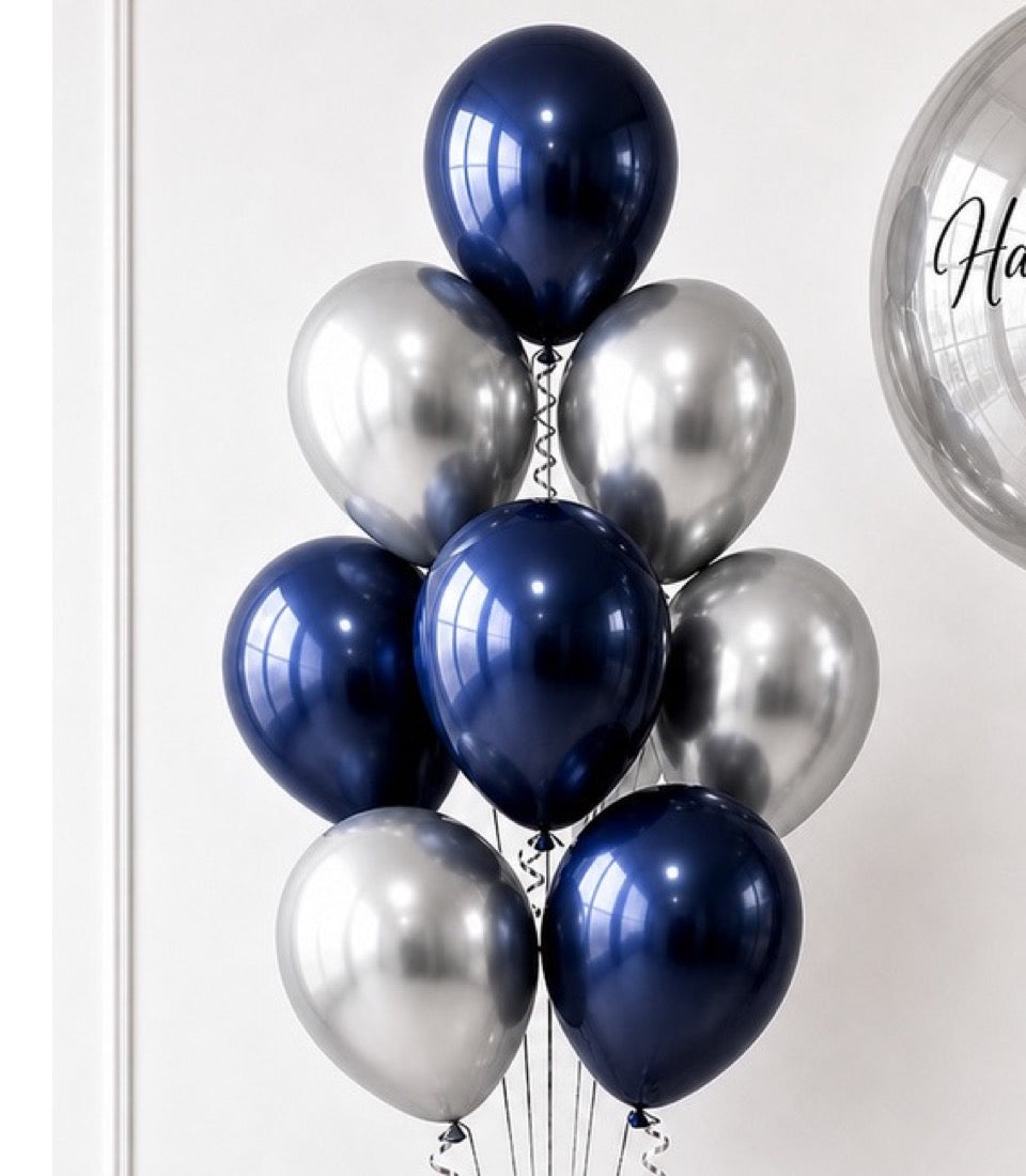 Metallic balloon bouquet with navy blue and silver chrome balloons arranged in a cluster with string ties against a white background.