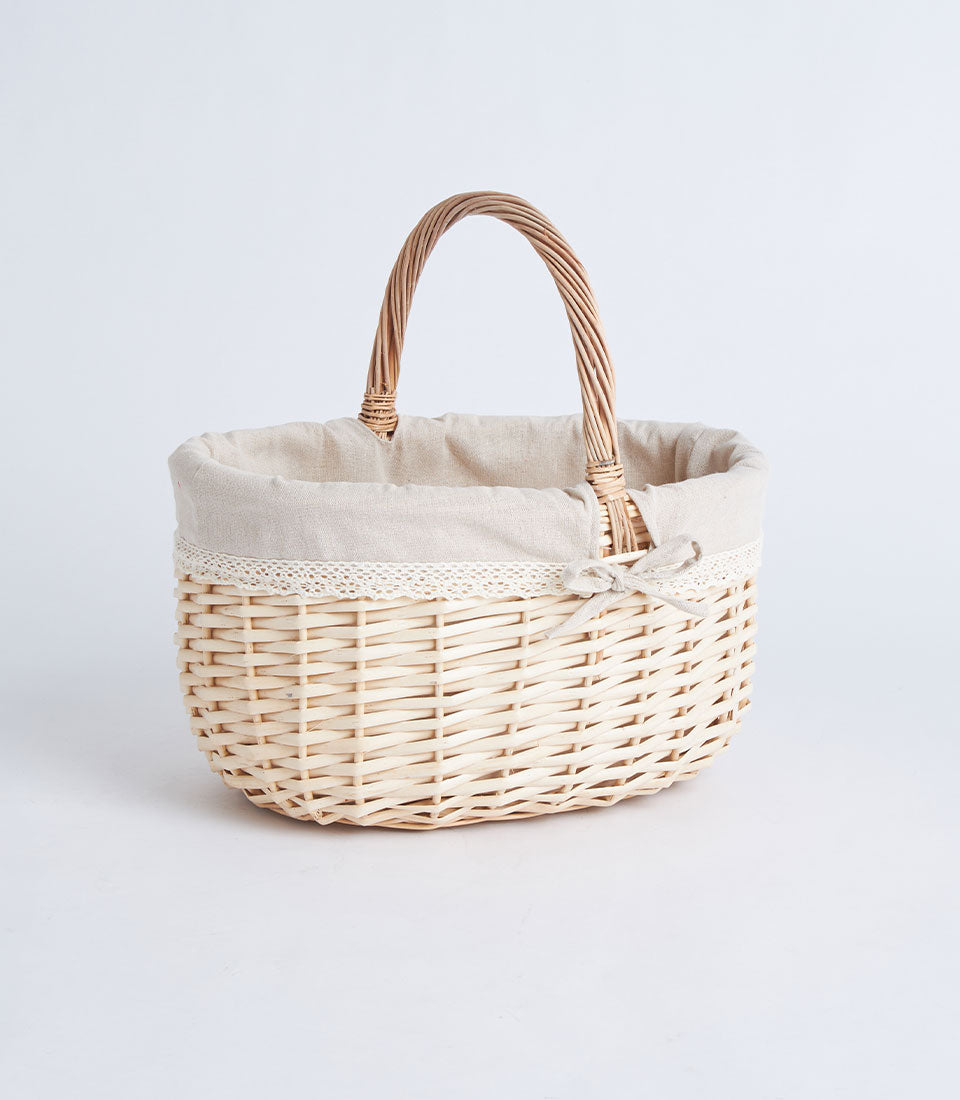 Light woven wicker basket with fabric liner, lace trim, and bow for flowers and fruit gifts