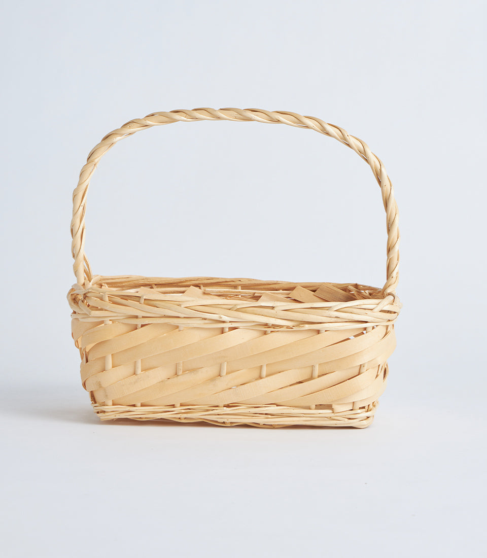 Natural woven bamboo rectangular basket with arched handle, light tan