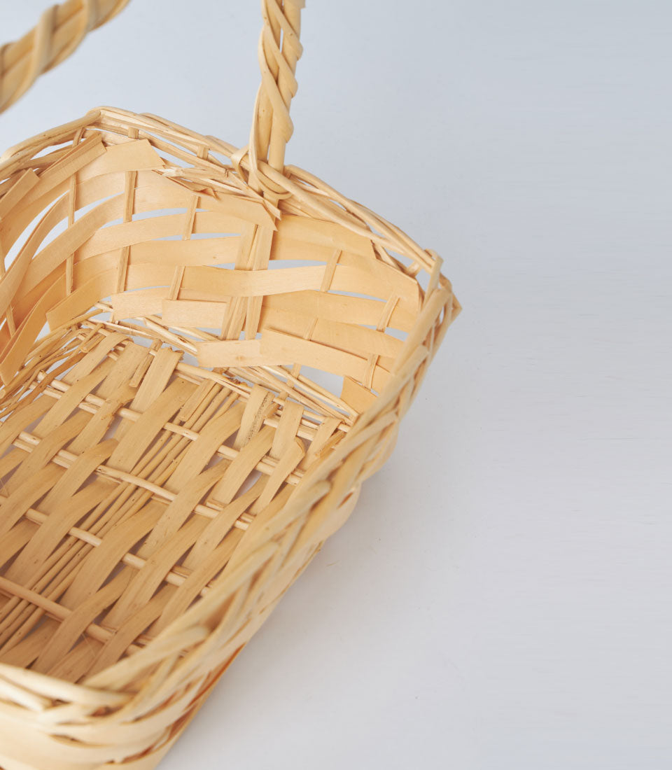 Natural bamboo rectangular basket with braided handle, light beige woven design for premium gift hampers