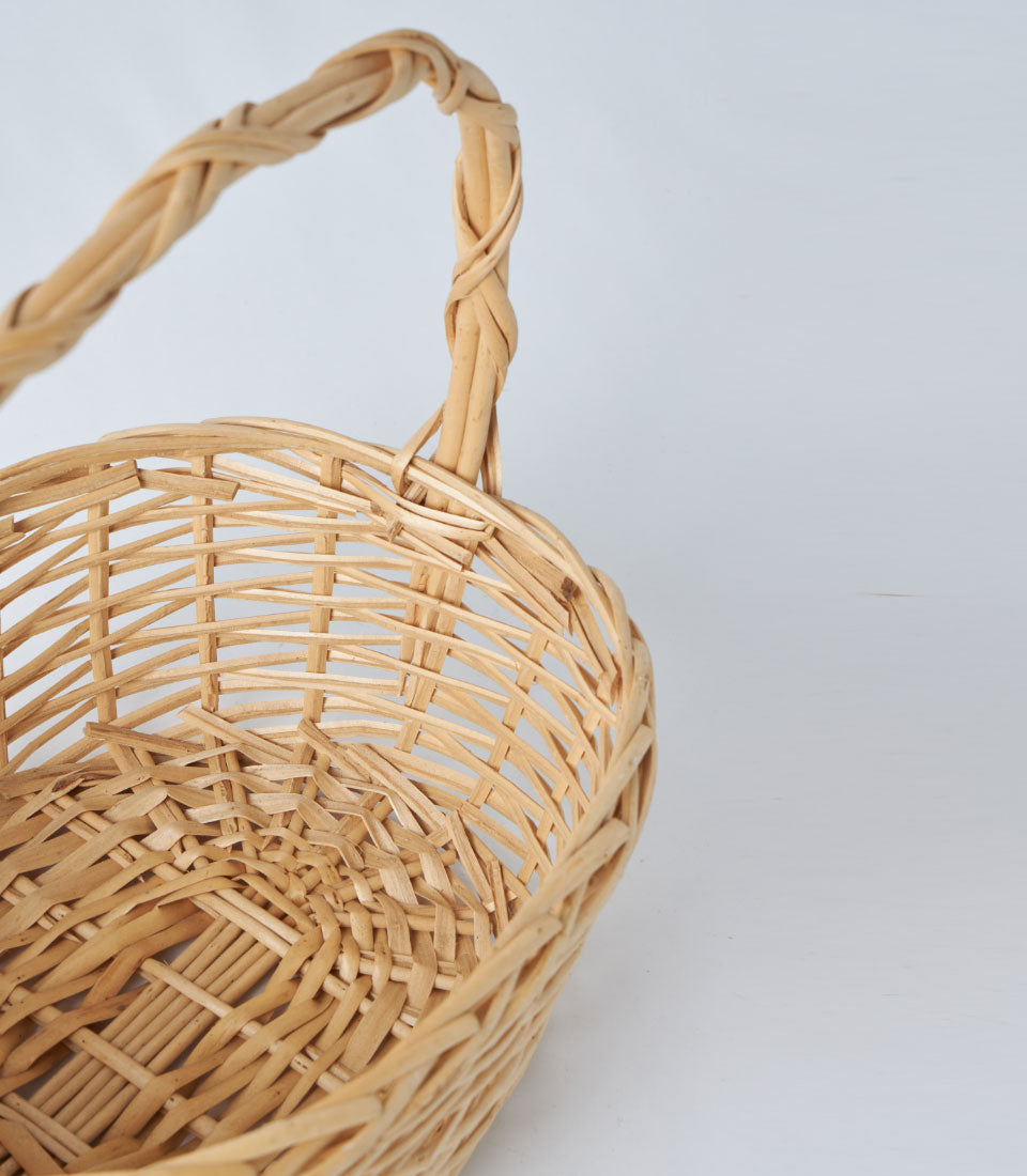 Natural woven wicker oval basket with braided handle for gourmet gifts and hampers