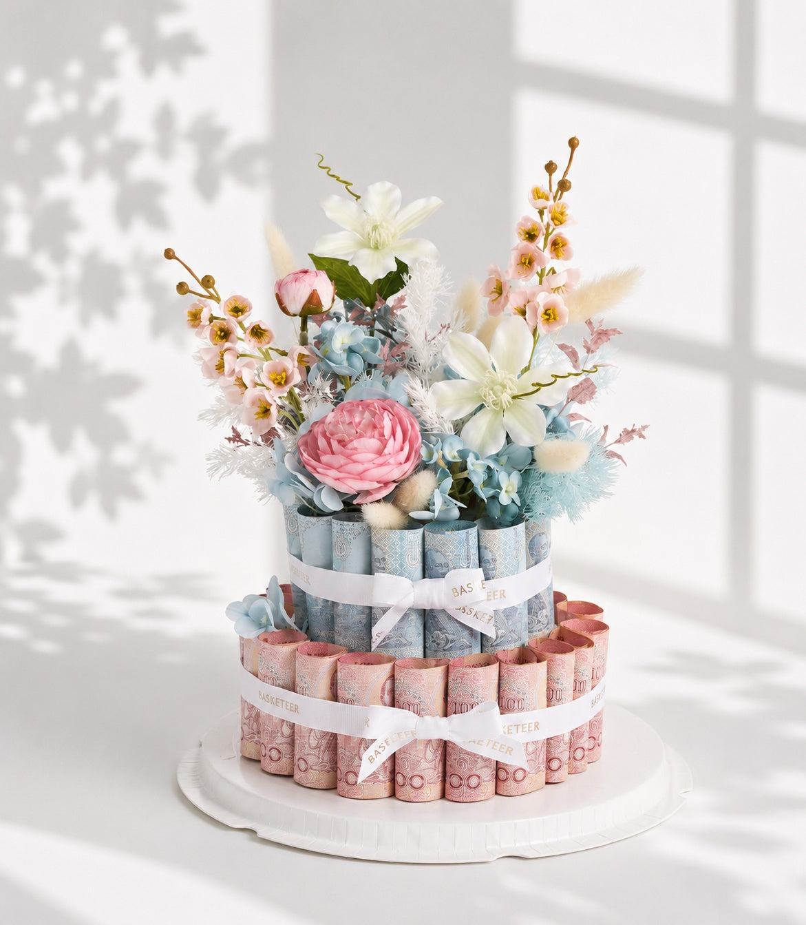 Elegant tiered money gift box arrangement from Flowers by Basketeer, featuring a