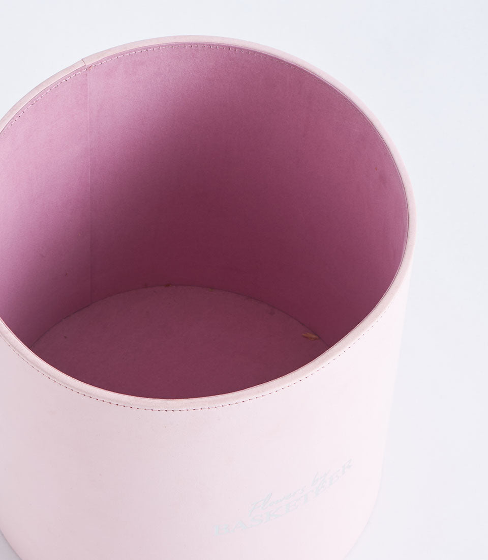 Basketeer's luxurious blush pink round gift box, ideal for a premium