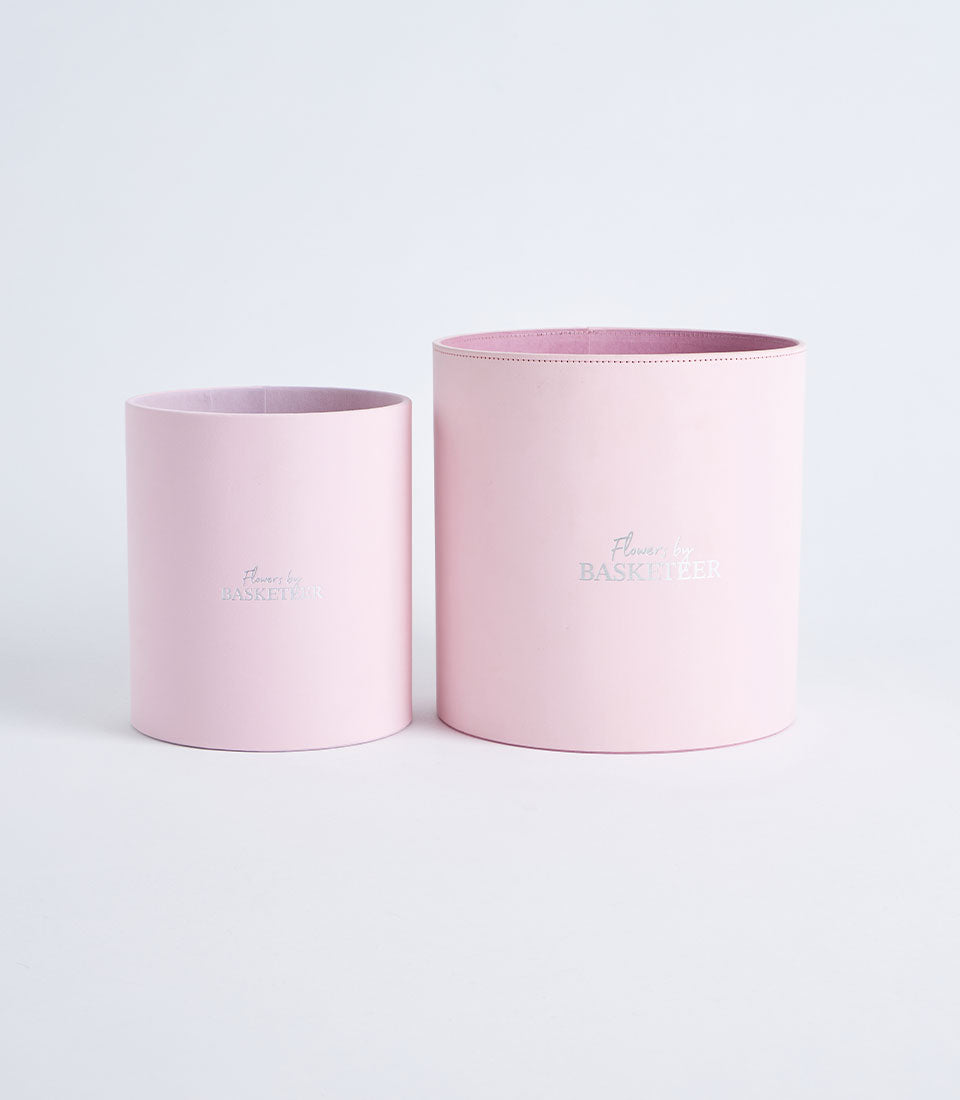 Basketeer's luxurious blush pink round gift boxes, perfect for premium hamper