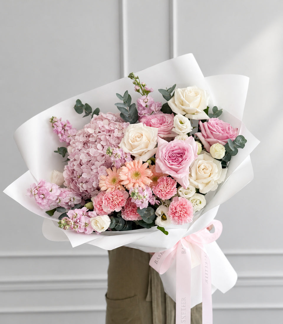 A luxurious blush and ivory rose bouquet from Flowers by Basketeer, featuring delicate