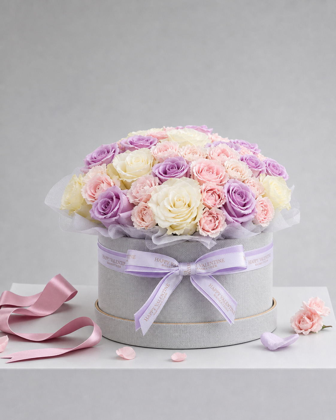 A romantic flower box arrangement from Flowers by Basketeer, featuring premium roses in