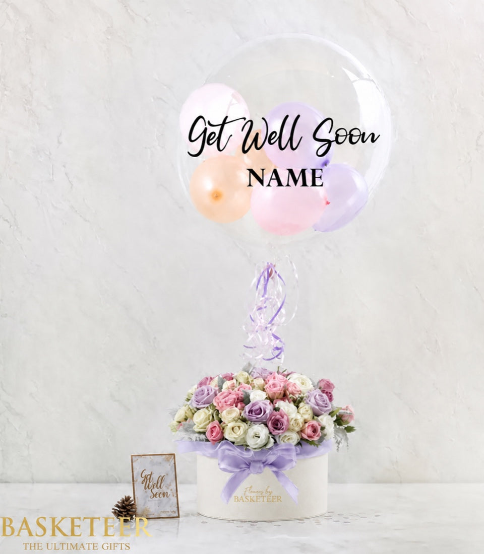 Basketeer luxury flower gift box with mixed purple and pink blossoms, tied