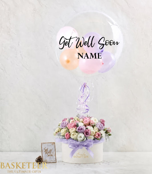 Basketeer luxury flower gift box with mixed purple and pink blossoms, tied