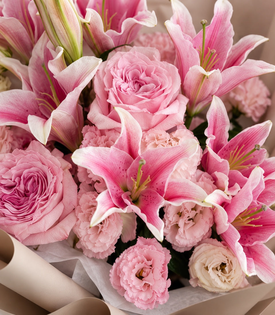 Close-up of Pink O'Hara roses and soft pink floral details in the Blush Reverie bouquet