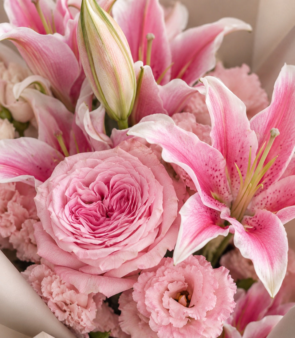 Detailed view of Pink O'Hara rose and fresh pink flower decorations