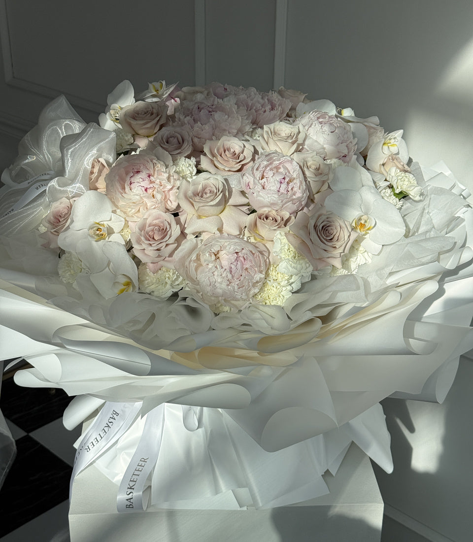 Close-up of luxury pink peonies, Quicksand roses and Phalaenopsis orchids