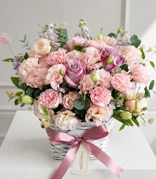 Elegant floral basket arrangement from Flowers by Basketeer, featuring a luxurious mix of pink