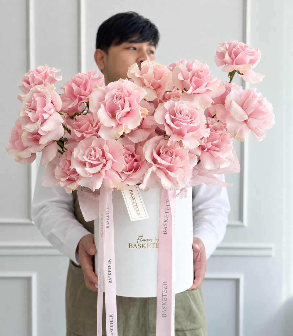 Model-held front view of pink Mondial rose flower box