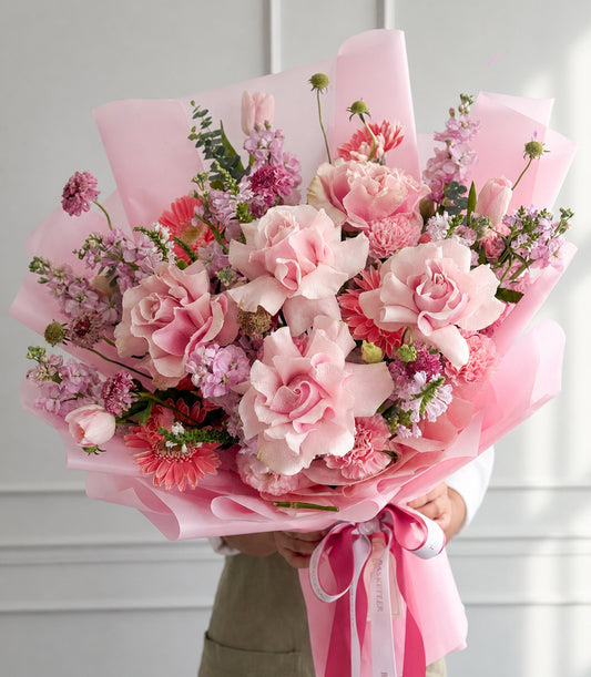 Basketeer's luxurious floral gift bouquet with soft pink Mondial roses, tulips