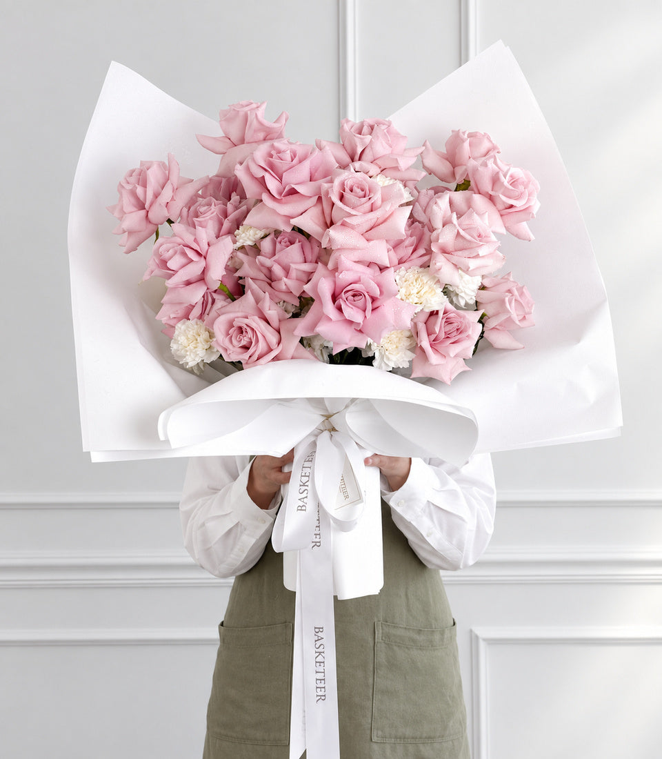 Full front model-held view of Fresh Lady pink rose bouquet