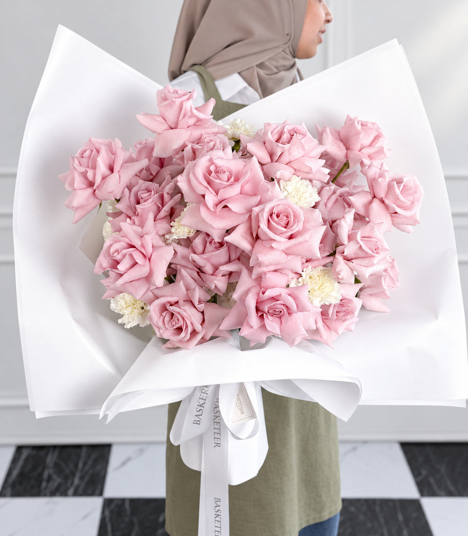Close-up model-held view of Fresh Lady pink roses