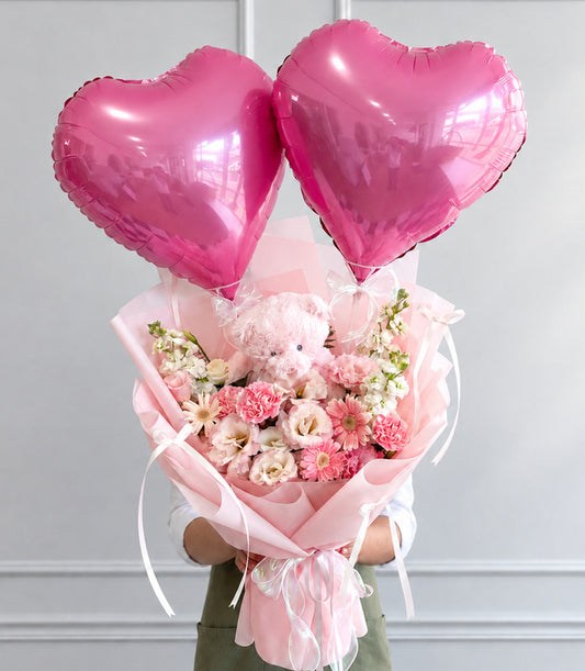 Basketeer's premium flower bouquet with two shiny pink heart balloons,