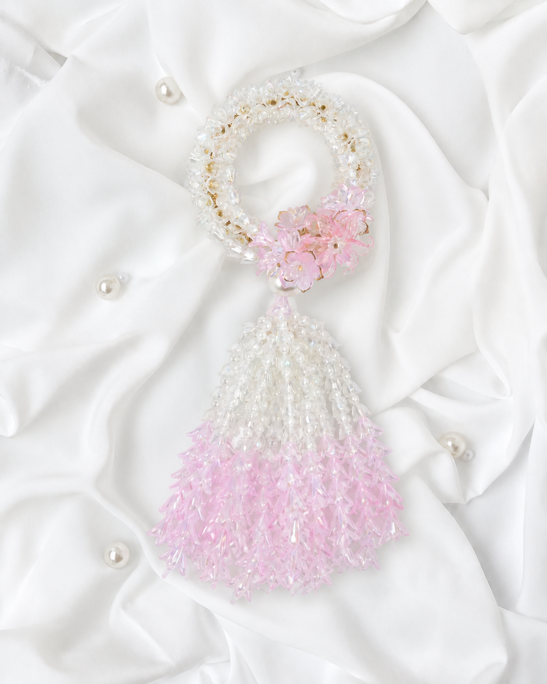 Basketeer's luxurious beaded jasmine garland in white and soft pink, elegantly