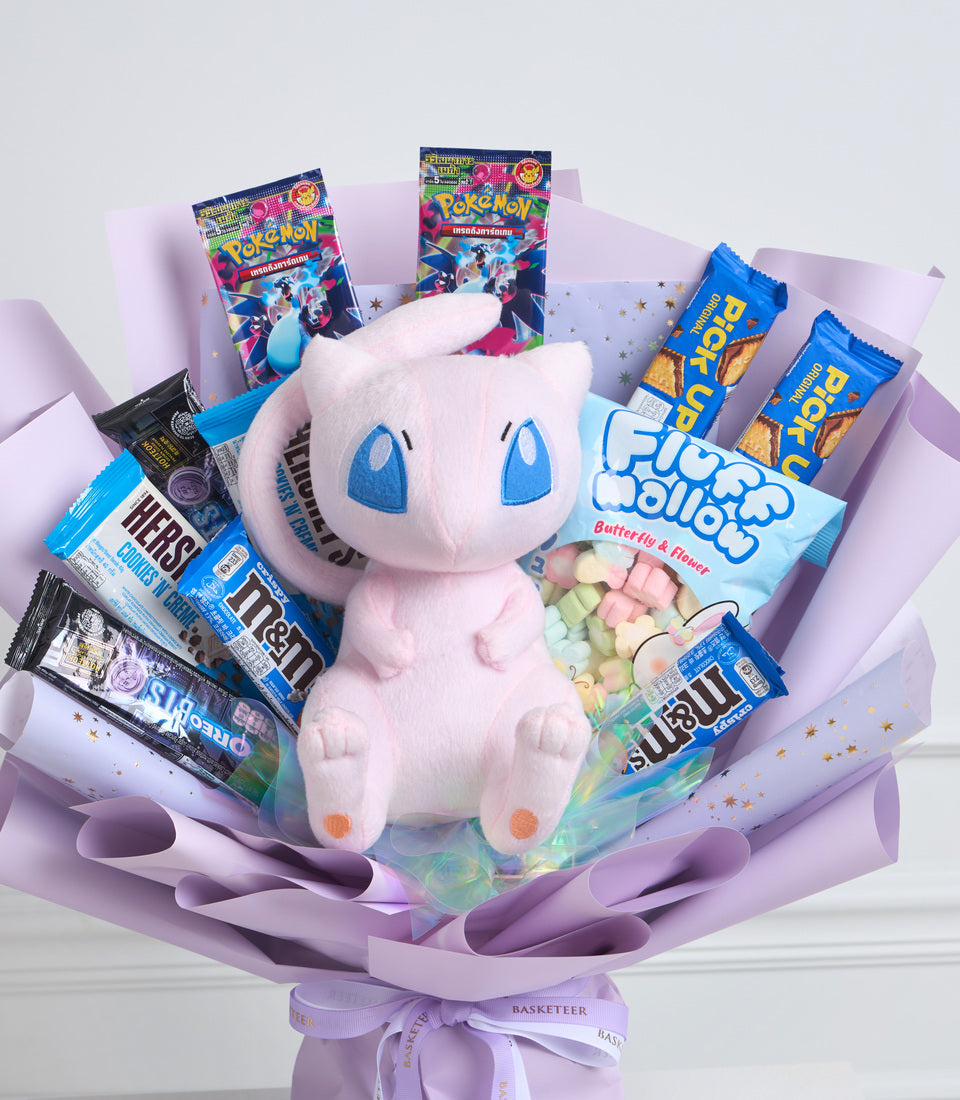 # Alt Text

Pokemon-themed gift bouquet featuring white plush Mew figure surrounded by purple wrapping, candy, snacks, and trading card booster packs.