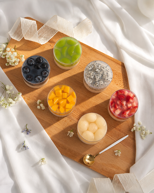 Artisan Charlotte Bakery fruit coconut jelly cups, with vibrant blueberries, mango, ly