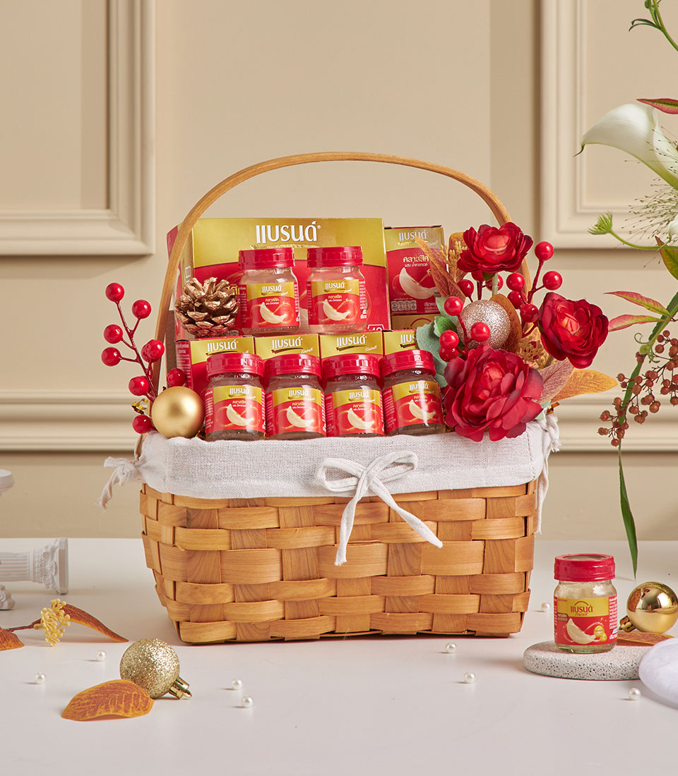 Luxury bird's nest health hamper with glass jars in woven basket, festive New Year gift with red florals and gold accents