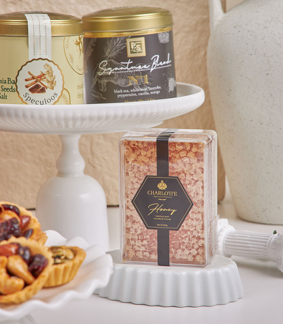 Basketeer premium hamper featuring artisanal honey, gourmet teas, and fruit tarts. A luxurious corporate gift idea for delivery in Bangkok.