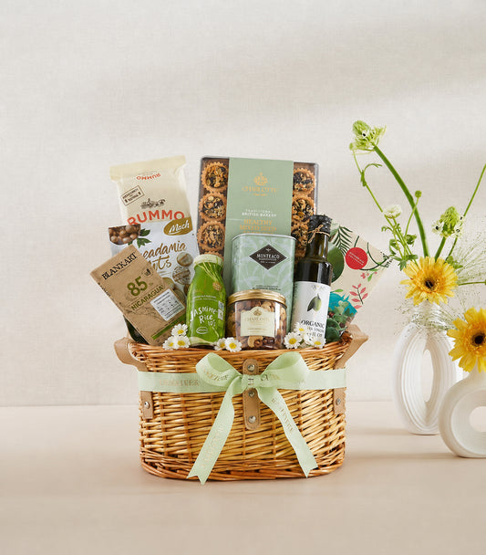Basketeer luxury gift basket with premium macadamia nuts, gourmet biscuits, and