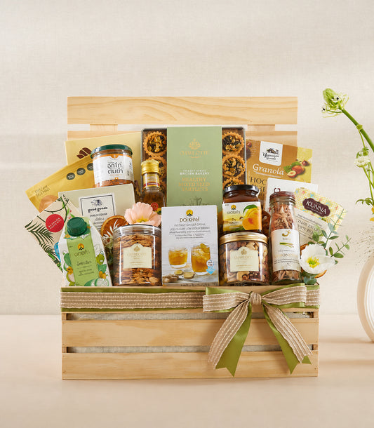 Basketeer premium organic gift hamper in a wooden crate, adorned with burlap and