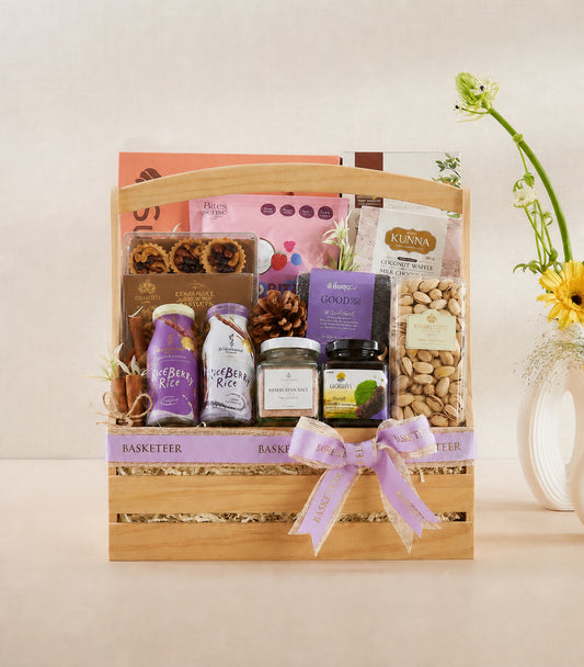 Basketeer premium wellness gift hamper in a wooden crate, featuring gourmet pistachios