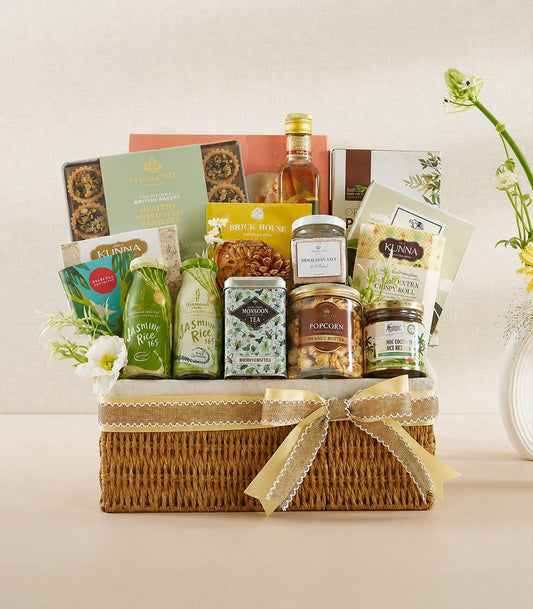 Basketeer luxury gourmet hamper with a woven wicker basket, adorned with a