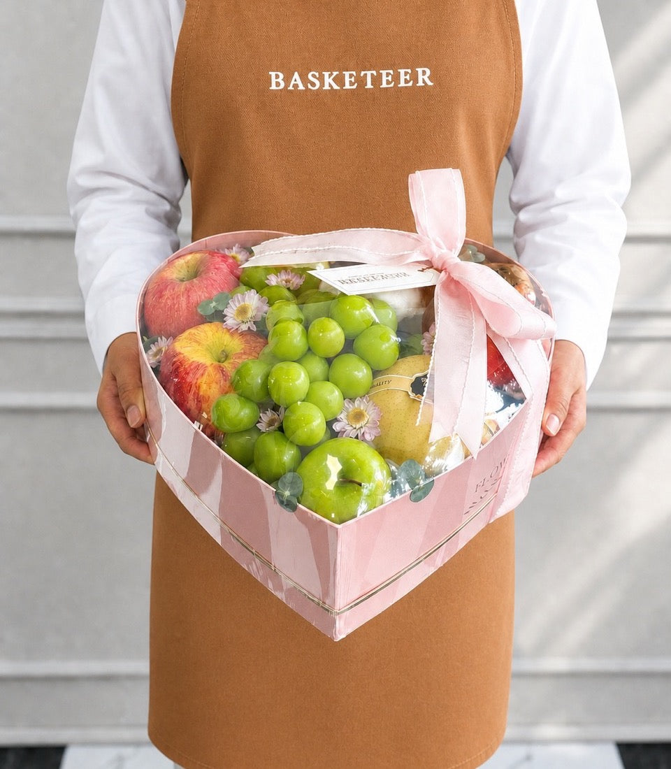 Basketeer's heart-shaped luxury gift box with vibrant red apples