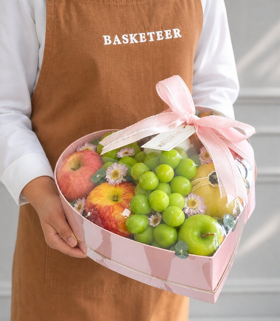 Basketeer's premium heart-shaped pink gift box filled with
