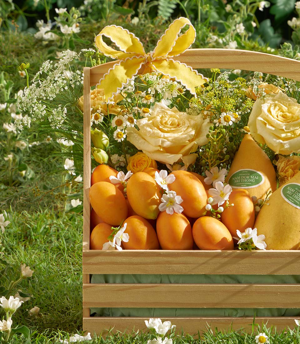 Premium mango and Mayongchid wooden crate with cream roses, yellow roses, and white daisies