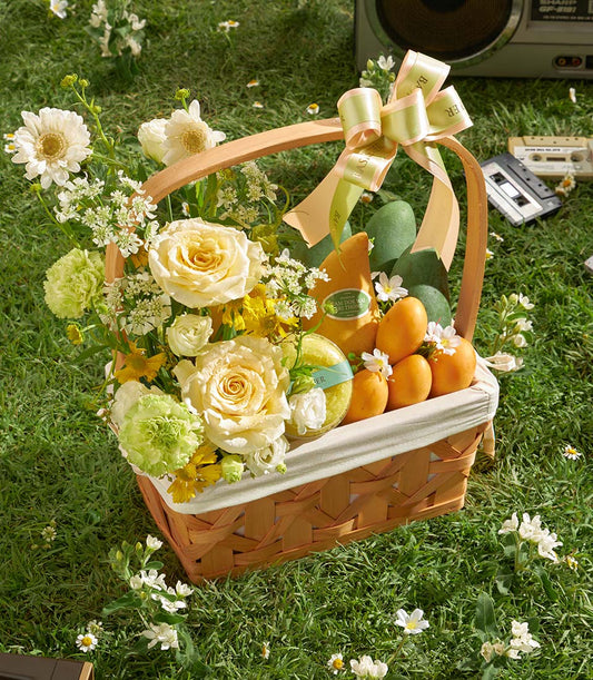 Premium mango and orchid gift basket with cream roses, fresh flowers, and tropical fruits