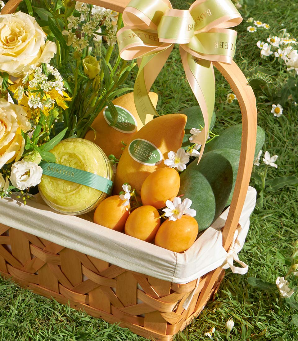 Premium mango and orchid gift basket with yellow roses, fresh tropical fruits and sticky rice