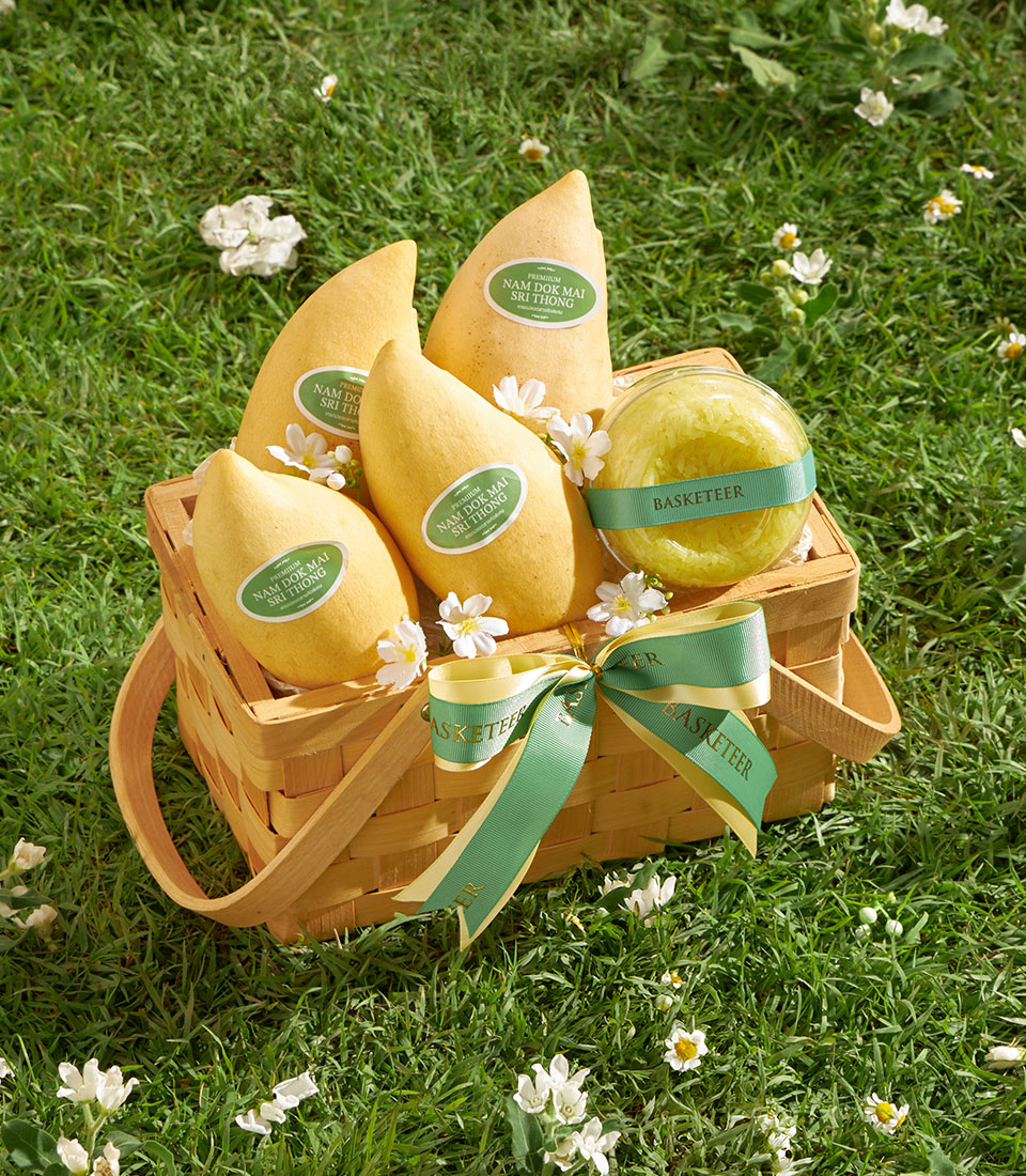Premium Nam Dok Mai mango basket with sticky rice and white flowers in woven basket